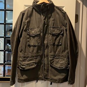 Gap size small canvas distressed jacket. Olive color. Hood zips into collar.
